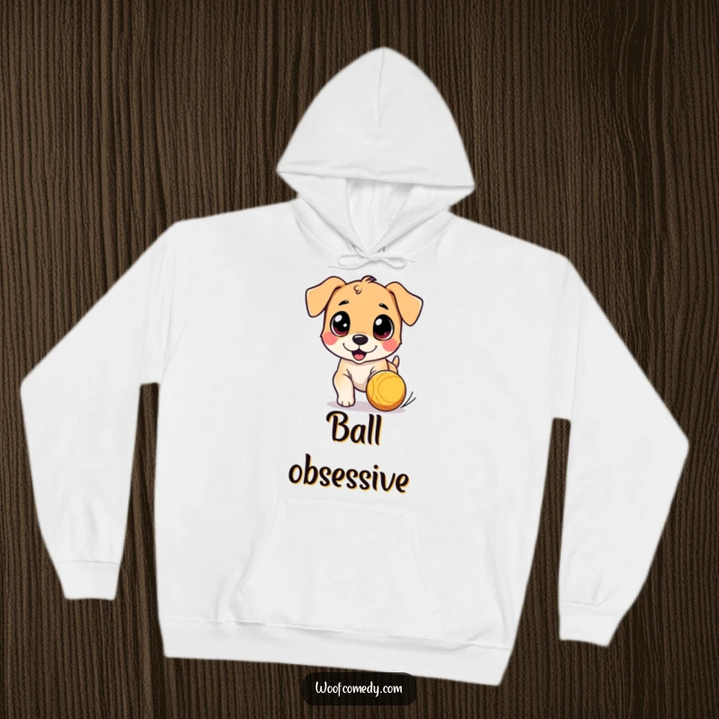 Funny hoodie featuring a cute dog character with wide eyes, joyfully chasing a bouncing ball, offering comfort and playful charm.