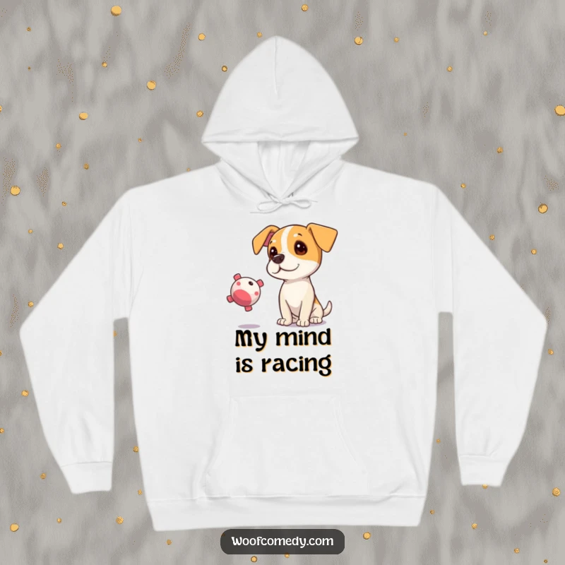 Funny hoodie featuring a curious dog tilting its head, eyes intently fixed on a floating squeaky toy.