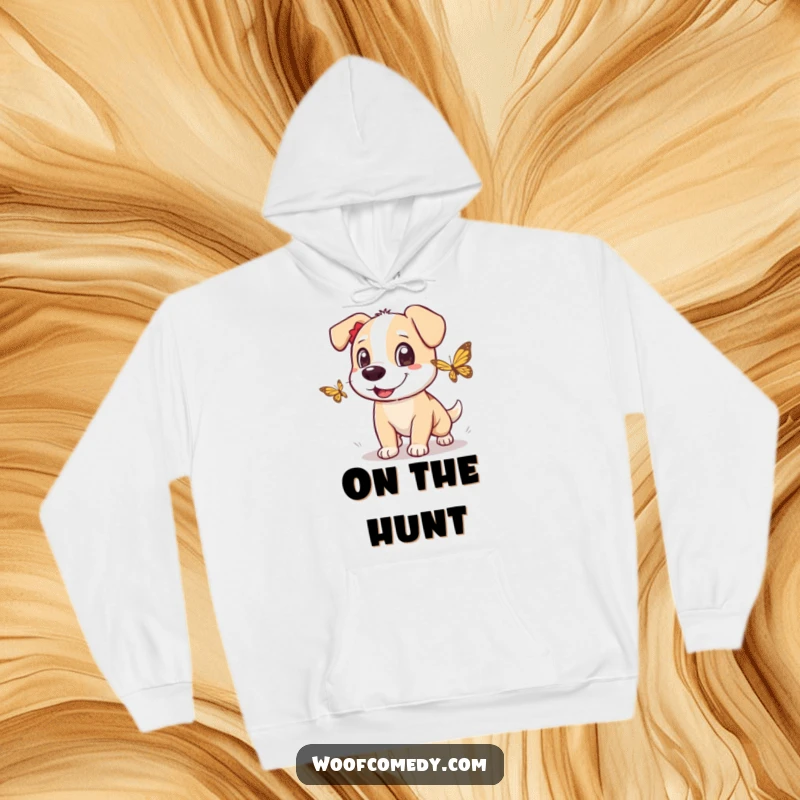 Funny dog hoodie depicting a dog with excited eyes enthusiastically chasing a fluttering butterfly, full of playful energy.